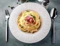 Top view plate of spaghetti ham with Cabonara cream source with fork and spoon Royalty Free Stock Photo