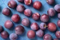 Top view of plum fruits on blue background