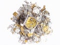 Top view of pocket watch on pile of spare parts Royalty Free Stock Photo