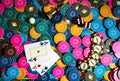 Top view of poker table with chips, cards and dice for playing poker. Set of poker colored chips, three aces and red Royalty Free Stock Photo