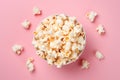 Top view of popcorn in bowl on pink background Royalty Free Stock Photo