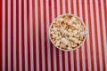 Top view of popcorn in bowl on striped background Royalty Free Stock Photo