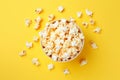 Top view of popcorn in bowl on yellow background Royalty Free Stock Photo