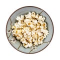 Top view of popcorn in ceramic bowl isolated Royalty Free Stock Photo