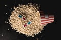 top view of popcorn spilled of cardboard bucket with 3d glasses