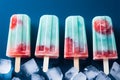 Top view of popsicles and ice cubes against a blue background Royalty Free Stock Photo