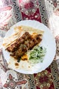 top view of portion of Armenian kebabs on plate Royalty Free Stock Photo