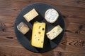 Top view of portions cheese on wooden table, Italian, French foo