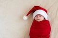 Top View Portrait First Days Life Newborn Cute Funny Sleeping Baby In Santa Hat Wrapped In Red Diaper At White Garland Royalty Free Stock Photo
