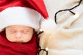 Top View Portrait First Days Of Life Newborn Cute Funny Sleeping Child Baby In Santa Hat Wrapped In Red Diaper At White Royalty Free Stock Photo