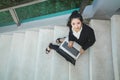 Top view portrait happy business woman in black suit sitting at Royalty Free Stock Photo