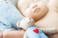 Top view Portrait of a newborn Asian cute baby boy wore blue Infant bodysuit on the bed , Charming Fat baby 5 month old lies in Royalty Free Stock Photo