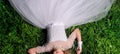 top view portrait of a pretty young girl relaxing on a grass