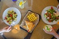 top view portrait of two young woman having lunch together at cafe. Royalty Free Stock Photo