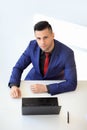 Top view portrait of young confident businessman sitting at his desk Royalty Free Stock Photo