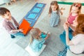 Top view of positive nice children sitting with a psychologist