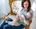 Top view of a positive young mother Royalty Free Stock Photo