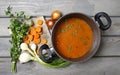 Top view on pot of tomato soup and fresh vegetables Royalty Free Stock Photo