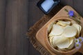 Top view of Potato chips bowl and salt on wood background with copy space Royalty Free Stock Photo