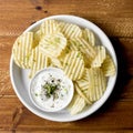 top view potato chips plate with sauce. High quality photo