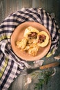 Top view on potato dumplings filled by smoked meat placed on wooden board Royalty Free Stock Photo
