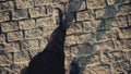 Top view POV of man in shoes walking at historical ancient sidewalk