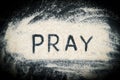 Top view of Pray word written on the sand Royalty Free Stock Photo