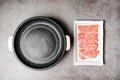 Top view of premium rare slices sirloin Wagyu A5 beef with high-marbling texture on a ceramic plate and marble coated non-stick