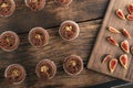 Top view preparation of cocoa muffins with nut filling. Homemade cakes