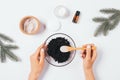 Top view process woman's hands making homemade cosmetic coffee scrub