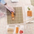 Top view of professional chef making and serving California sushi rolls in kitchen Royalty Free Stock Photo