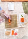 Top view of professional chef making and serving California sushi rolls in kitchen Royalty Free Stock Photo