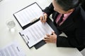 Top view of a female recruiter reading a candidate's resume during a job interview Royalty Free Stock Photo