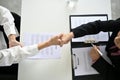 Top view of a recruiter shaking hands with a young male candidate after a job interview Royalty Free Stock Photo