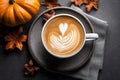 Top view of pumpkin and grey cup of coffee accompanied by a charming fall-themed arrangement. Vibrant orangery pumpkins and Royalty Free Stock Photo