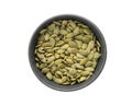 Top view pumpkin seeds in black bowl isolated on white background Royalty Free Stock Photo