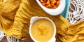 Top view Pumpkin soup cream in a white bowl spiced with curry. Delicius Pumpkin C