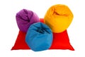 Top view on purple, blue and yellow beanbag chairs on red beanbag sofa Royalty Free Stock Photo