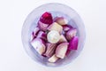 Top view of purple onions in blender on white background Royalty Free Stock Photo