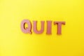 Quit word letters alphabet letters on Yellow background