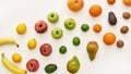 Top view of rainbow composition of various colorful fresh fruits isolated over white background Royalty Free Stock Photo