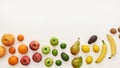 Top view of rainbow composition of various colorful fresh fruits isolated over white background Royalty Free Stock Photo