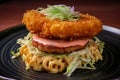 Top view of a Ramen burger with a crispy shrimp patty and wasabi mayo on a colorful plate