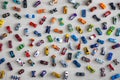 Top view random collection of model sport car toy hot wheels on wooden floor Royalty Free Stock Photo