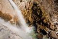 Top view of rapid waterfall stream flowing down the high rock in Martvili canyon on autumn day