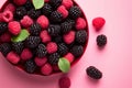 Top view of raspberry and blackberry fruits in bowl