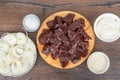 Top view of raw beef liver pieces, onion rings, salt and sour cream. Royalty Free Stock Photo