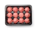 Top view of raw beef meatballs in plastic tray