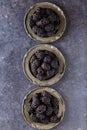 Top view on raw blackberries in plate on dark table background Royalty Free Stock Photo