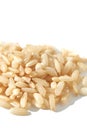 A top view of raw brown and white rice, forming a heap. The integral Royalty Free Stock Photo